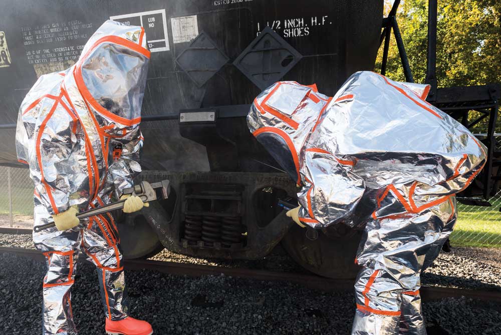 First responders in Frontline 500 Chemical/FR protection suits work to stop a chemical leak on a tanker car