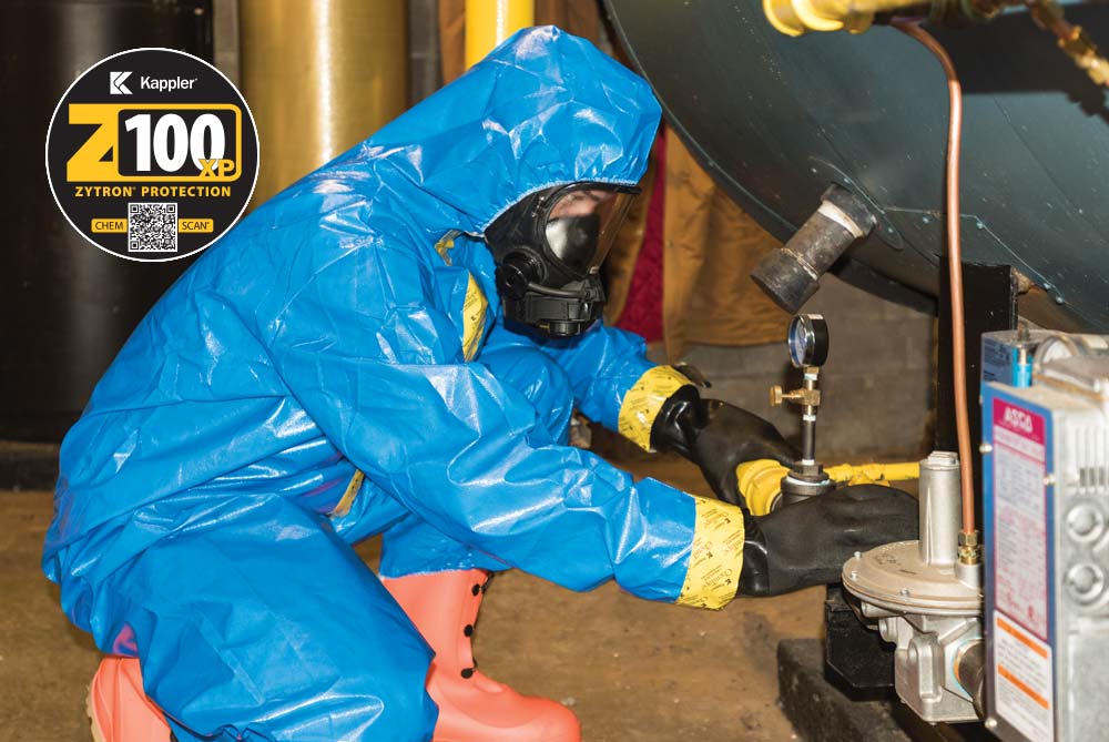 Worker in Zytron 100XP suit working in a building maintenance room where chemicals are
present
