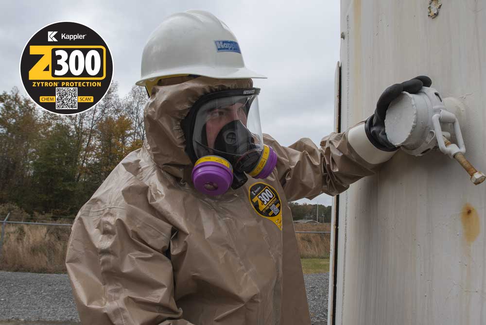 Worker in Zytron 300 protective suit inspects chemical containers and pipes for chemical or gas leaks