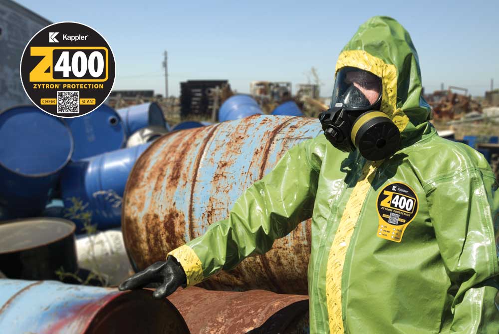 Worker in Zytron 400 suit cleans up hazardous chemicals that were not disposed of properly