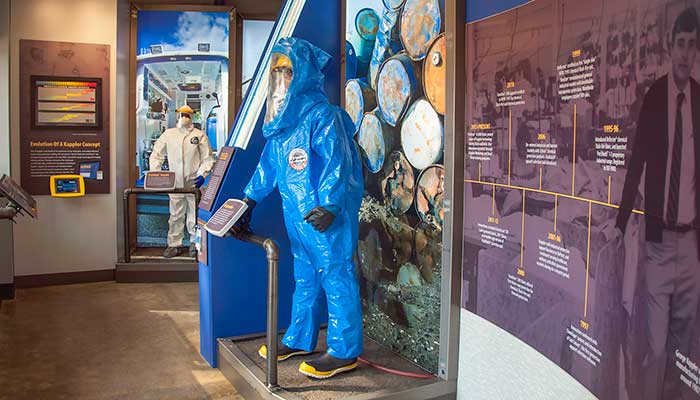Blue gas-tight Kappler suit on display beside the company history timeline at the Kappler Museum
