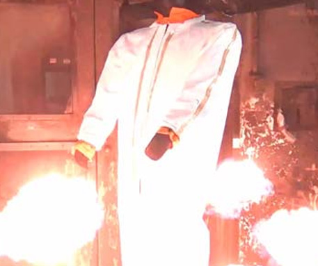 White Zytron 300 FR coverall on a Pyroman flame-test mannequin engulfed in flames