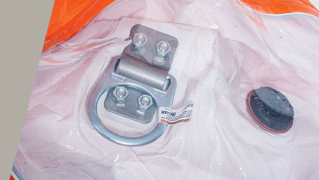 Metal D-ring anchor and exhaust valve built into a Kappler suit as a custom option