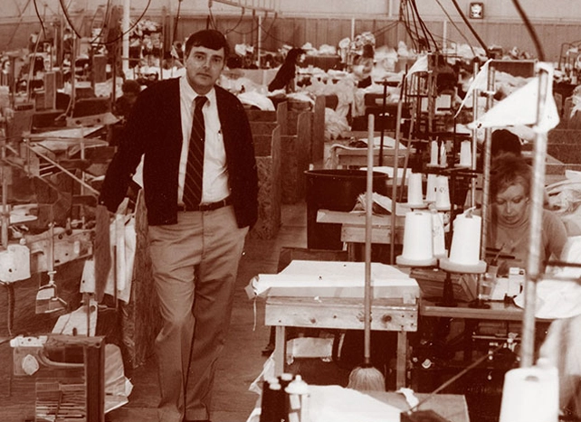 Vintage sepia photo of a man on Kappler's early sewing manufacturing floor