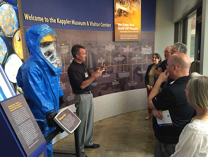 Guide addressing visitors at the Welcome to the Kappler Museum and Visitor Center timeline wall